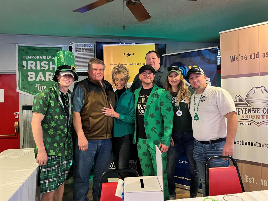 Dave Weiderspon, and his wife Kathy, of Sidney, celebrate with staff members from 987 The Big Boy after Dave's name was drawn during the annual St. Paddy's Day Party for a pair of club seats to see Shania Twain in Lincoln on May 19.
