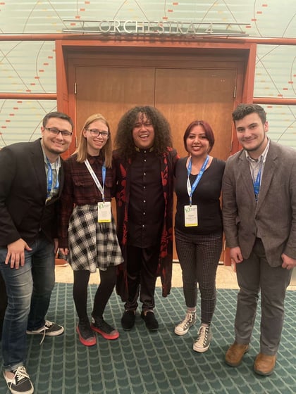Chadron State College students, from left, Josh Fernau of Chadron, Madison Schafer of Sturgis, S.D., Rayne Charging Thunder of Gordon Neb., and Wyatt Ellis of Hot Springs, S.D., pose with the conductor of the Indigenous People's Immersion Choir.