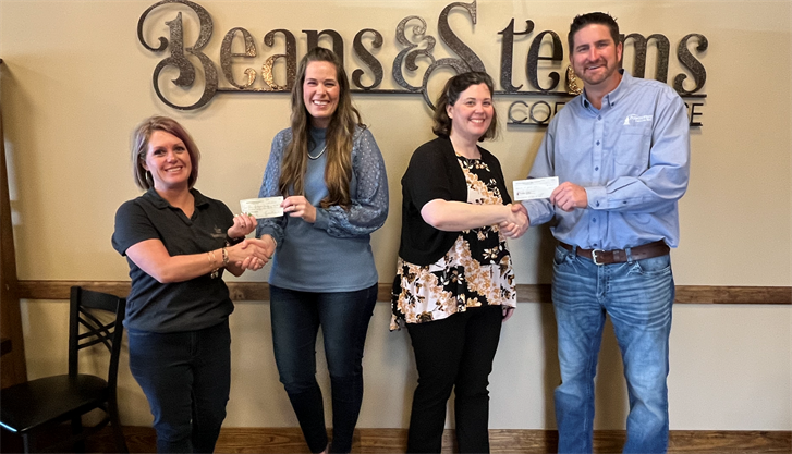 Pictured from left are Kiersten Richards (Beans & Steams Coffee House), Courtney Heesacker, Tabitha Adden, and Rick Heckenlively (Points West Bank). Beans & Steams Coffee House and Points West Bank made a donation to The Ark ministry.
