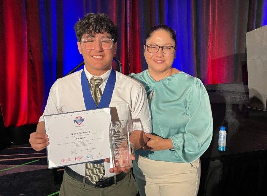 Albino "Binny" Canales (left) was named to the All-USA Academic Team and won the New Century Transfer Scholarship. He accepted his awards at the American Association of Community Colleges annual convention in early April.