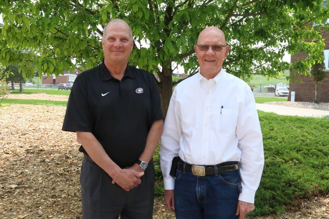 Chadron State College President Randy Rhine, left, poses with Gary Beiganski May 19, 2023. (Photo by Con Marshall)