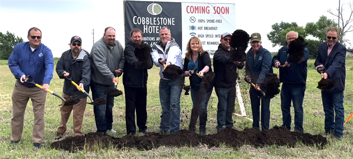 Company and community officials take part in a ceremonial groundbreaking for the new Cobblestone Hotel coming to Julesburg, Colo.