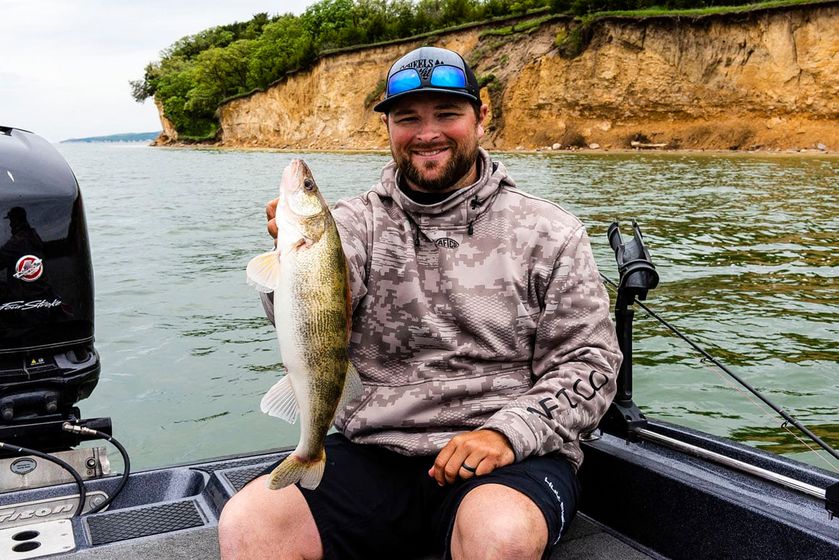 Mike Hansa of Yutan, a fishing guide with The Walleye Guys, holds a walleye he caught while fishing on Lewis and Clark Lake State Recreation Area in Knox County.