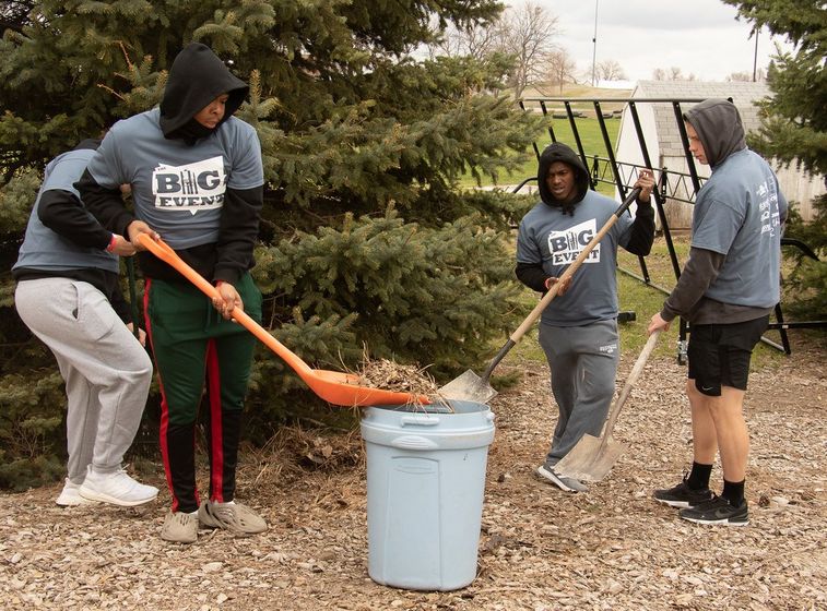 Chadron State College student volunteers clear away debris at the Chadron Aquatics Center during the 11th The Big Event April 15, 2023.