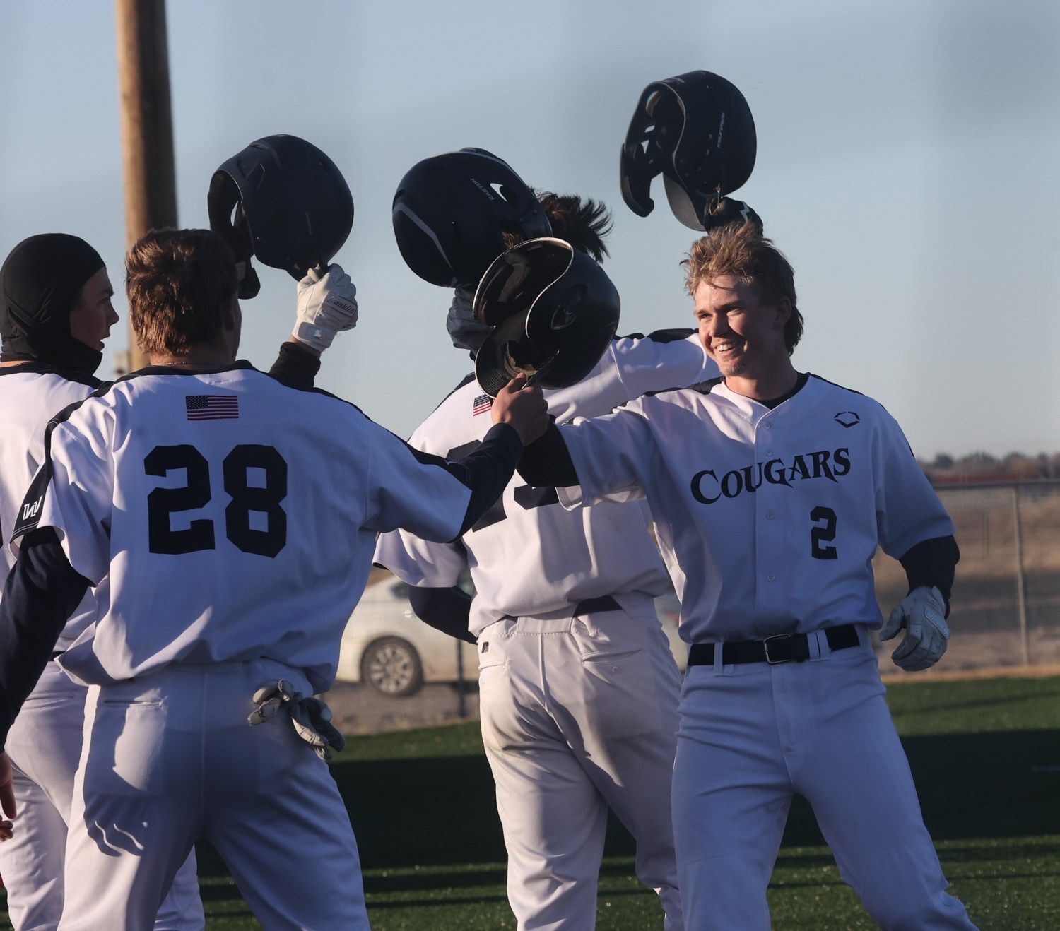Dylan Harris is congratulated at home plate after hitting his second home run of game two.