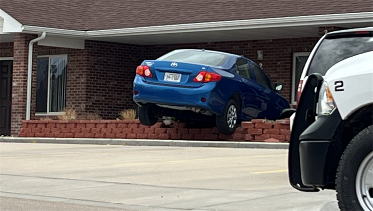 A blue sedan went out of control and stopped on top of a planter at Canterbury Estates this morning.