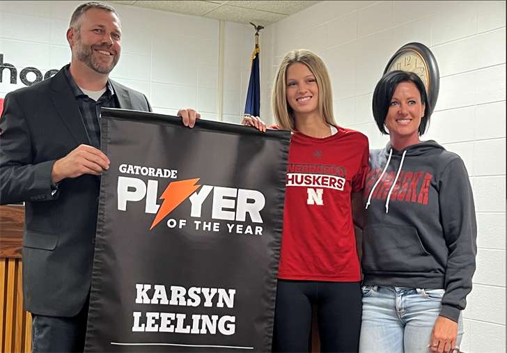 From left: School Board President Mike Palmer, Karsyn Leeling and her mother Amanda Sharman.