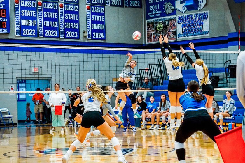 Shelton’s Jalyn Branson sends a kill past the Overton defense earlier this year.