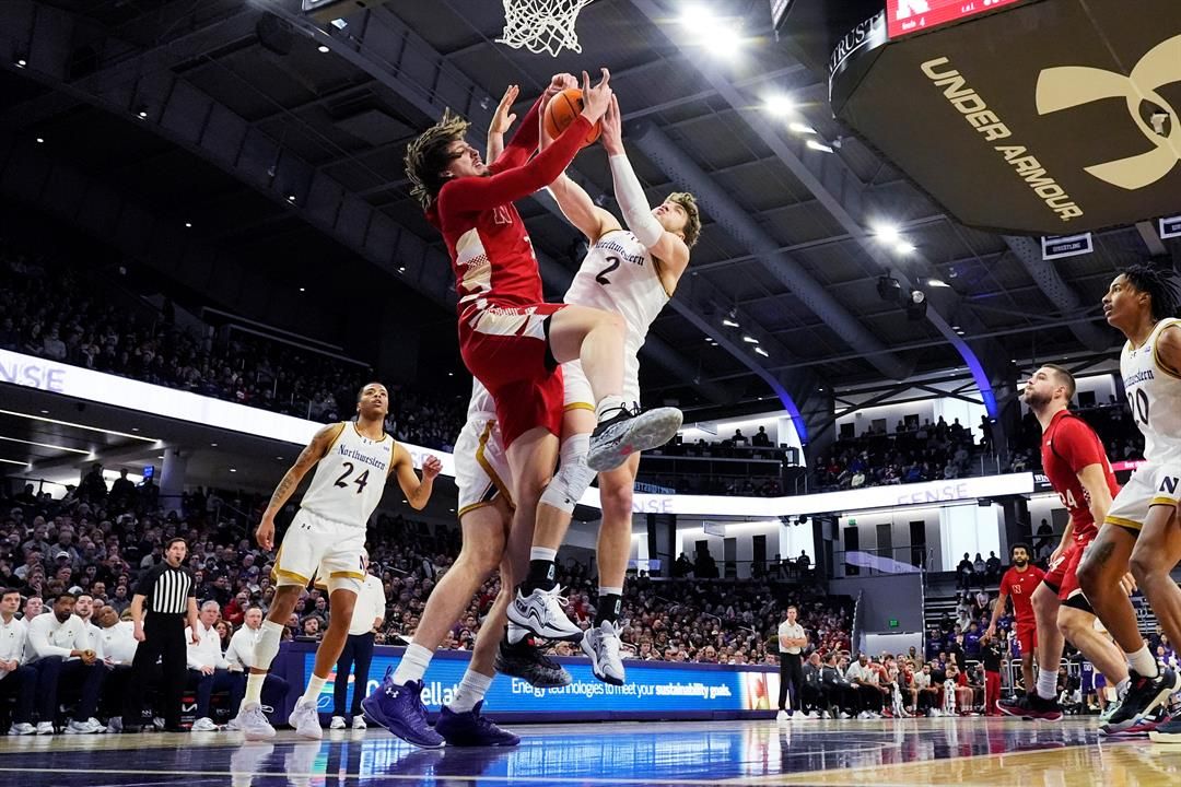 Nebraska center Braxton Meah, left, and Northwestern forward Nick Martinelli (2) battle for a rebound during the first half of an NCAA college basketball game in Evanston, Ill., Sunday, Feb. 16, 2025.