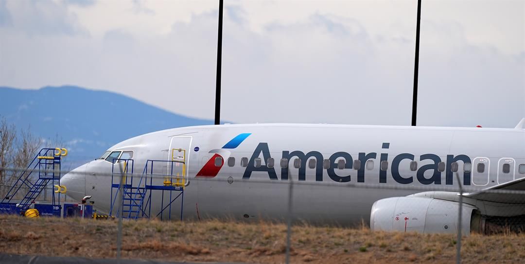 An American Airlines jetliner that caught fire after landing Thursday at Denver International Airport sits near a hangar at the airport Friday, March 14, 2025, in Denver.