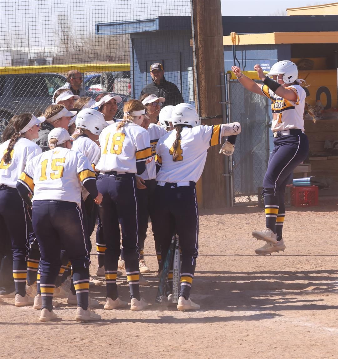 Lydia Tibbals gets ready to jump on home plate and then get mobbed by her teammate safter hitting the 2-run walk-off home run against Lamar on Sunday.