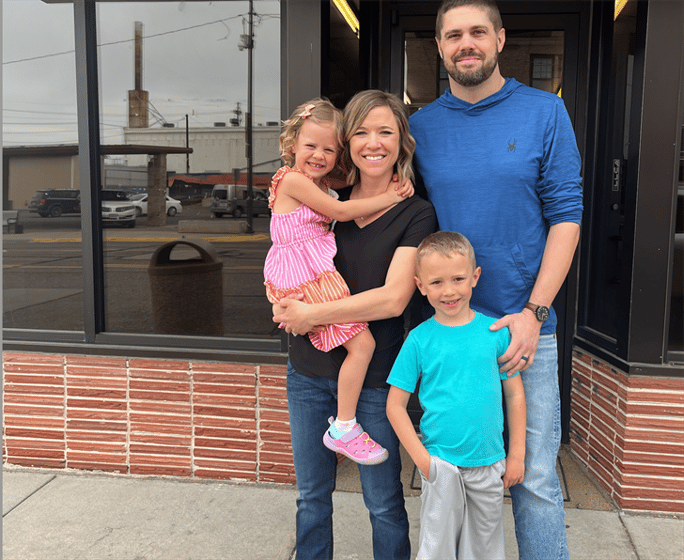 The Price family stands in front of the future location of Price Cream at 827 10th Ave. in Sidney.