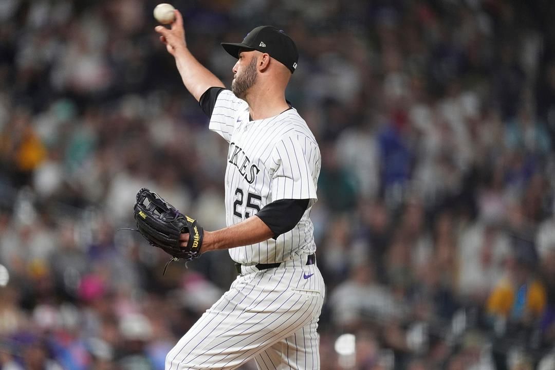 Normally a catcher, Colorado Rockies' Jacob Stallings works as a relief pitcher against the San Diego Padres in the eighth inning of a baseball game Saturday, May 10, 2025, in Denver.