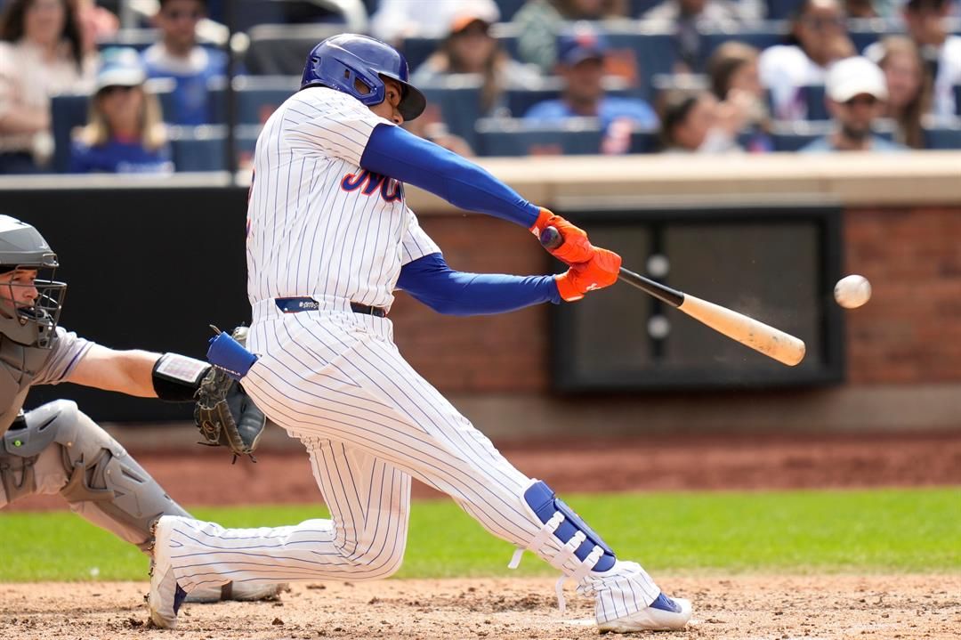 New York Mets' Juan Soto hits a solo home run during the eighth inning of a baseball game against the Colorado Rockies, Sunday, June 1, 2025, in New York.