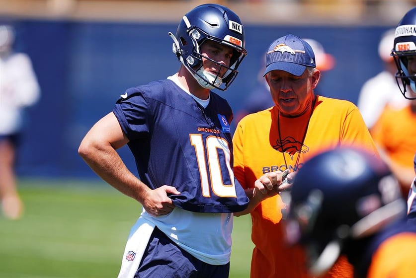 Denver Broncos quarterback Bo Nix, left, confers with head coach Sean Payton during practice at NFL football minicamp, Tuesday, June 10, 2025, in Centennial, Colo.