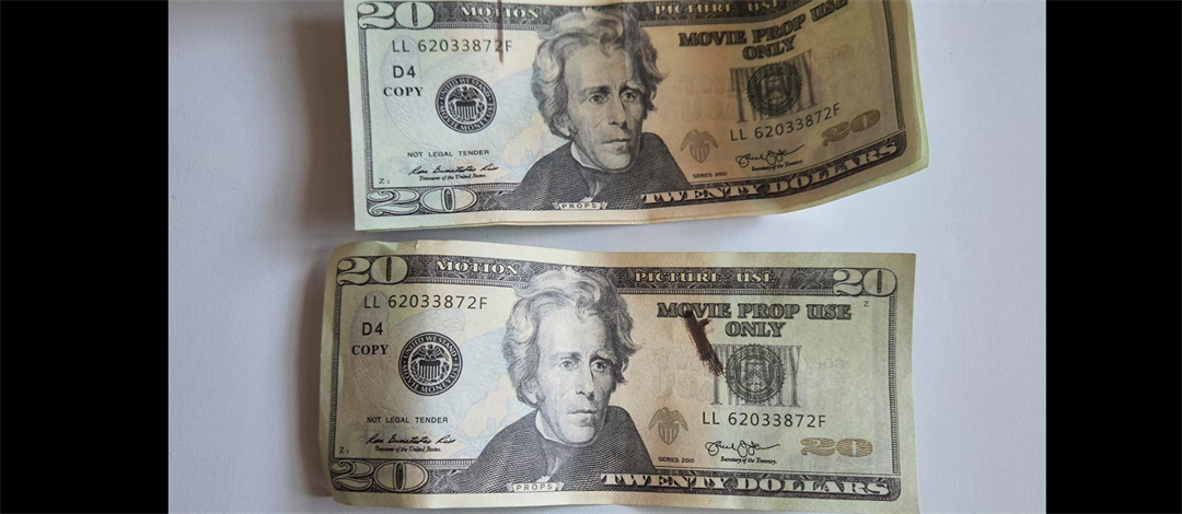 Authorities are alerting the community of individuals using currency marked "fake money" or "movie prop."