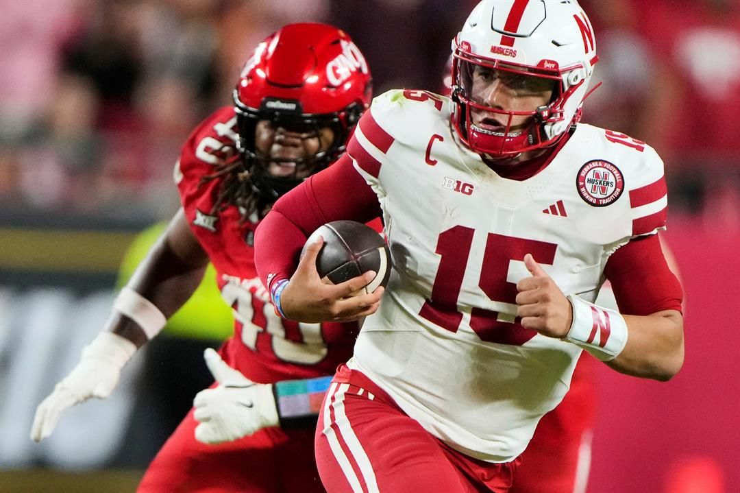 Cincinnati defensive lineman Kamari Burns (40) chases Nebraska quarterback Dylan Raiola (15) during the second half of an NCAA college football game Thursday, Aug. 28, 2025, at Arrowhead Stadium in Kansas City, Mo.