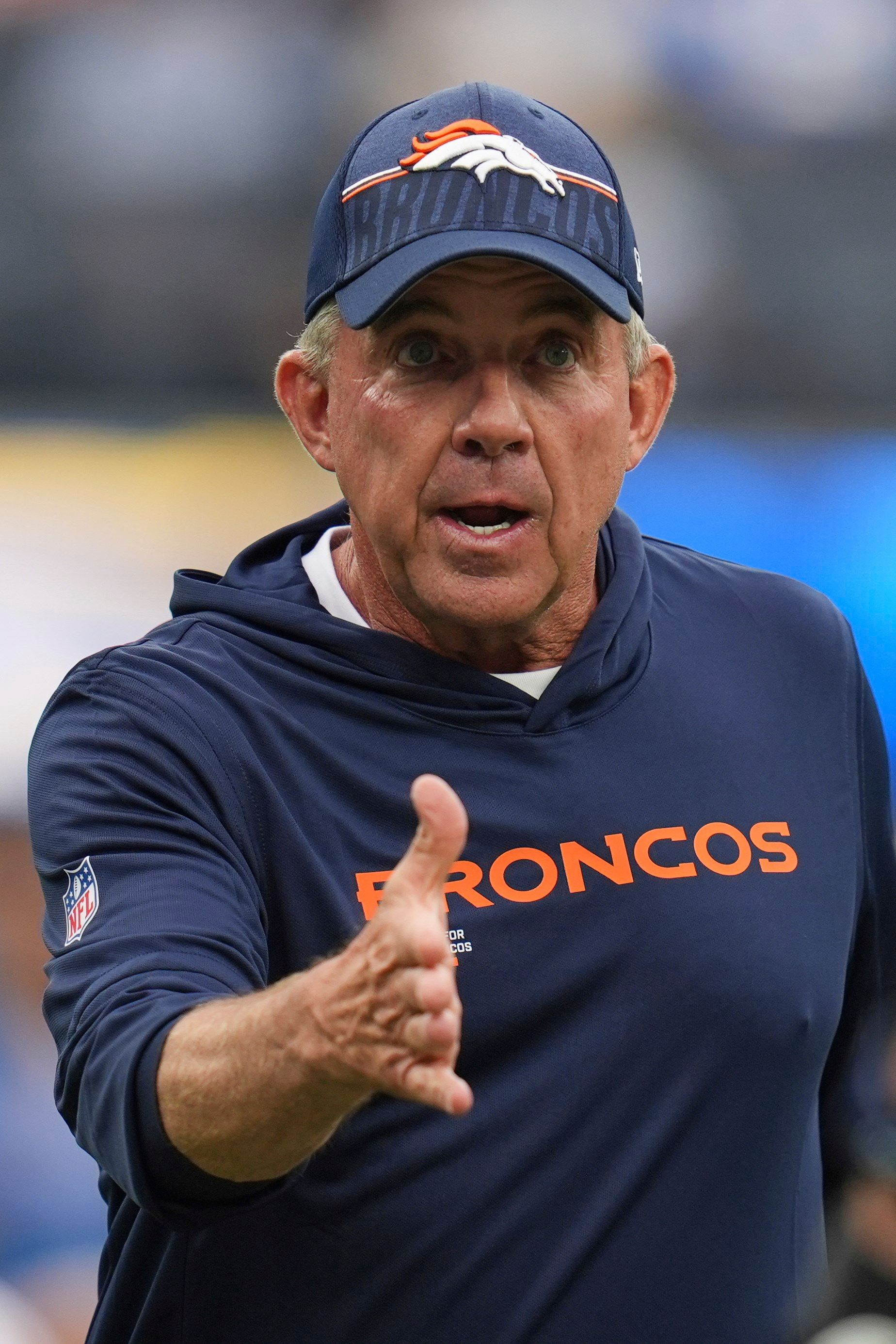 Denver Broncos head coach Sean Payton shakes hands with players before an NFL football game against the Los Angeles Chargers, Sunday, Sept. 21, 2025, in Inglewood, Calif.