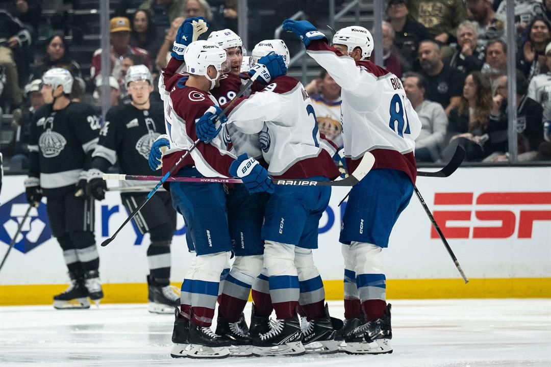 Colorado Avalanche players celebrate a goal by center Martin Necas (88) during the second period of an NHL hockey game against the Los Angeles Kings, Tuesday, Oct. 7, 2025, in Los Angeles.