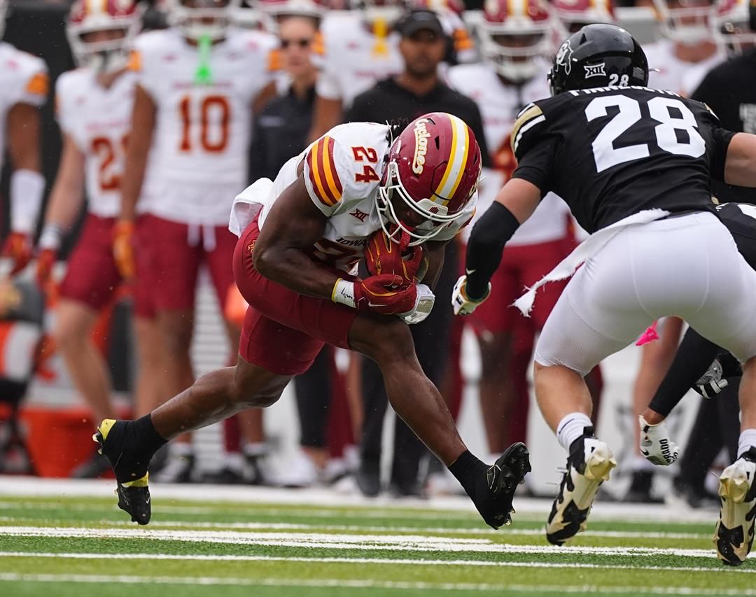 Iowa State running back Abu Sama, left, runs for a short gain as Colorado defensive back Ben Finneseth comes in for a tackle in the first half of an NCAA college football game Saturday, Oct. 11, 2025, in Boulder, Colo.