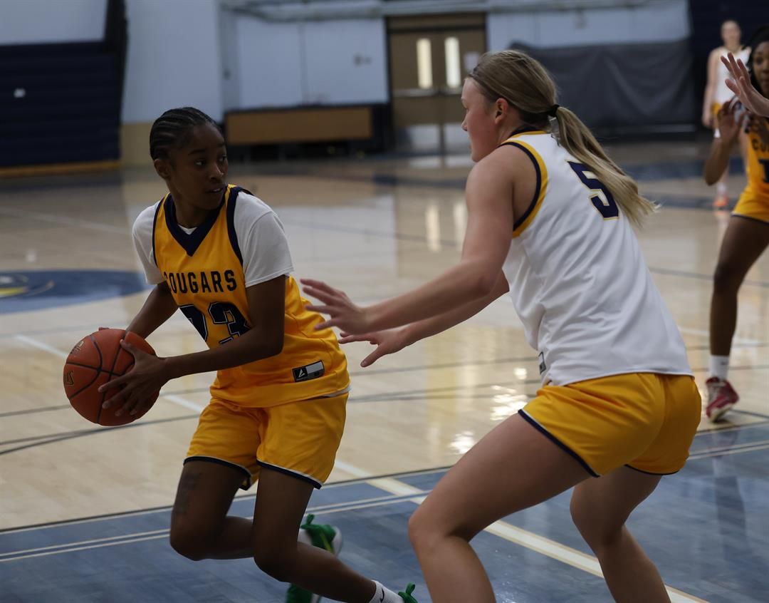 Juseana-Rae Delatori (4) looks to make a pass while being guarded by Ella Chesta-Carty during the first official day of practice October 1.