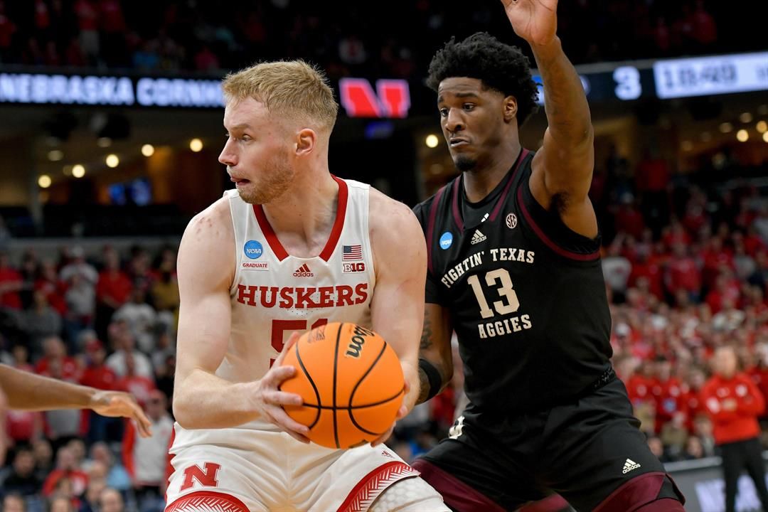 Nebraska forward Rienk Mast (51) looks to pass the ball away from Texas A&M forward Solomon Washington (13) during the first half of a first-round college basketball game in the NCAA Tournament, March 22, 2024, in Memphis, Tenn.