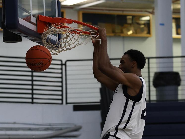 Dorin Nguema goes up to slam home a dunk in the first practice on October 1.