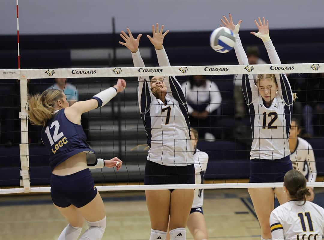 WNCC's Keira Zelada and Maria Niedzwiecka go up for a block on a LCCC player in the first match of the Region IX tourney on Wednesday.