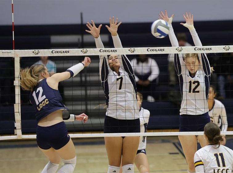 WNCC's Keira Zelada and Maria Niedzwiecka go up for a block on a LCCC player in the first match of the Region IX tourney on Wednesday.