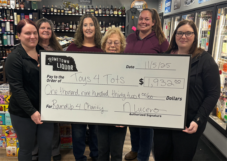 Pictured from left: Hometown Liquor's Kaitlyn Marcellus; representing Toys for Tots: RuthAnn Emersen, Tammy Segelke, Nancy Sanders, Toshia Jones and Kendra Mitchell.