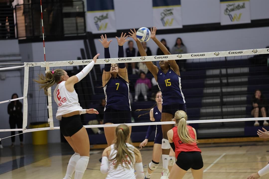 WNCC's Keira Zelada and Nadiyyah Northern go up for a block on Casper's Peyton Carruth.