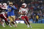 Lateef's impressive debut as a starter and Johnson's rushing lead Nebraska over UCLA 28-21