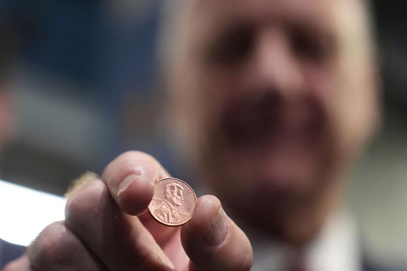 U.S. Treasurer Brandon Beach holds one of the last pennies pressed at the U.S. Mint in Philadelphia, Wednesday, Nov. 12, 2025.