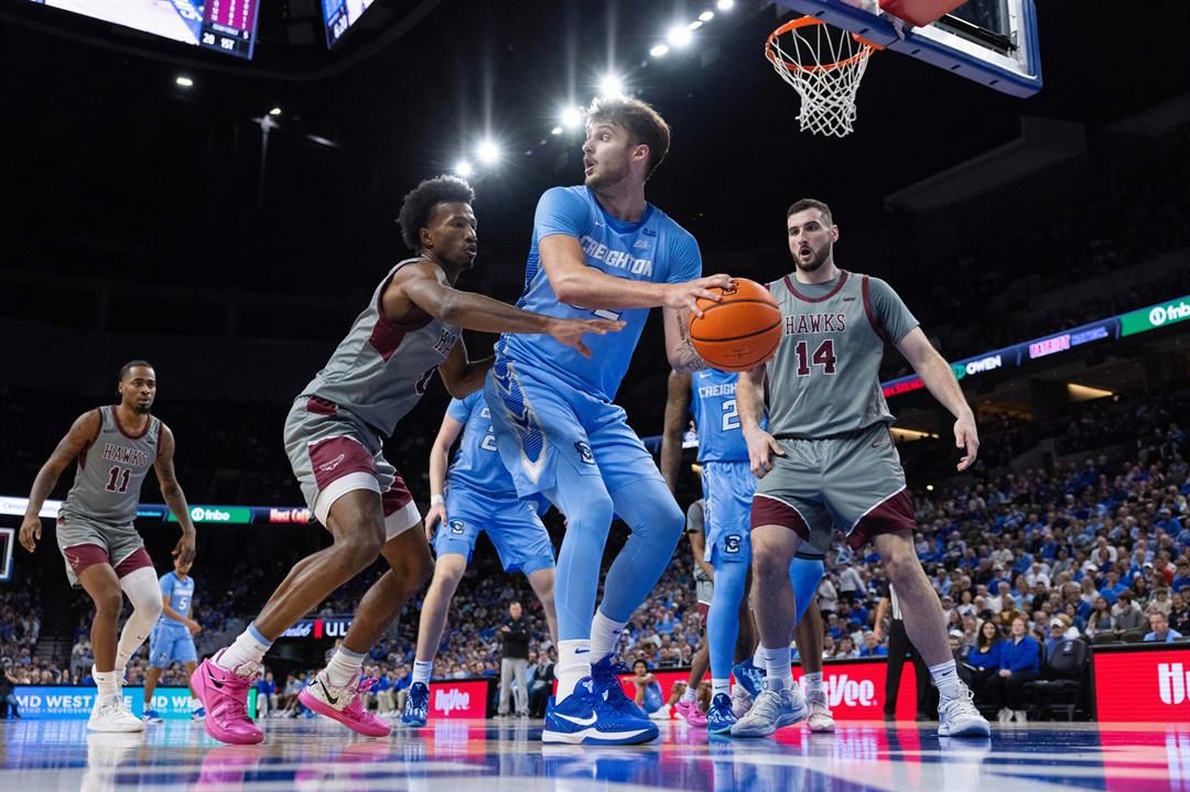 Maryland-Eastern Shore's Jaden Cooper, left, reaches for a rebound against Creighton's Owen Freeman during the first half of an NCAA college basketball game Friday, Nov. 14, 2025, in Omaha, Neb.