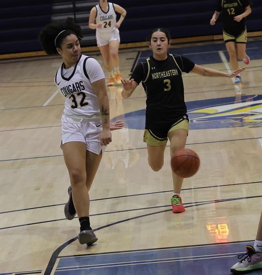 Ella Chesta-Carty delivers a behind-the-back pass to Aniaya Burton-Hernandez Saturday against NJC.