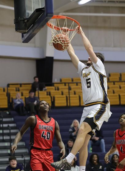 Viktor Lukic-Gavric goes up for a dunk in their game with Dawson on Monday.