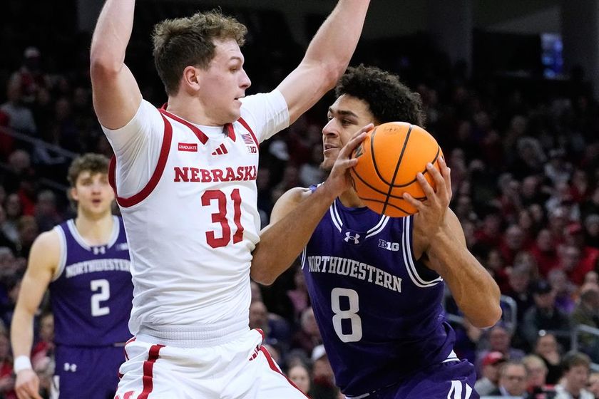 Northwestern forward Tre Singleton (8) drives with the ball as Nebraska guard Cale Jacobsen (31) defends during the second half of an NCAA college basketball game in Evanston, Ill., Saturday, Jan. 17, 2026.