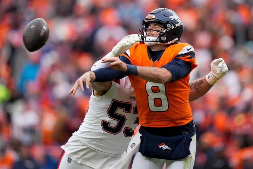 New England Patriots linebacker Christian Elliss (53) sacks Denver Broncos quarterback Jarrett Stidham (8) during the first half of the AFC Championship NFL football game, Sunday, Jan. 25, 2026, in Denver.