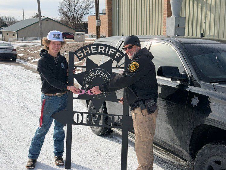 Creek Valley senior delivers custom sign to Deuel County Sheriff’s Office