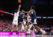 College hoops roundup: No. 2 UConn pulls away late in 1st half on way to 85-58 rout of struggling Creighton