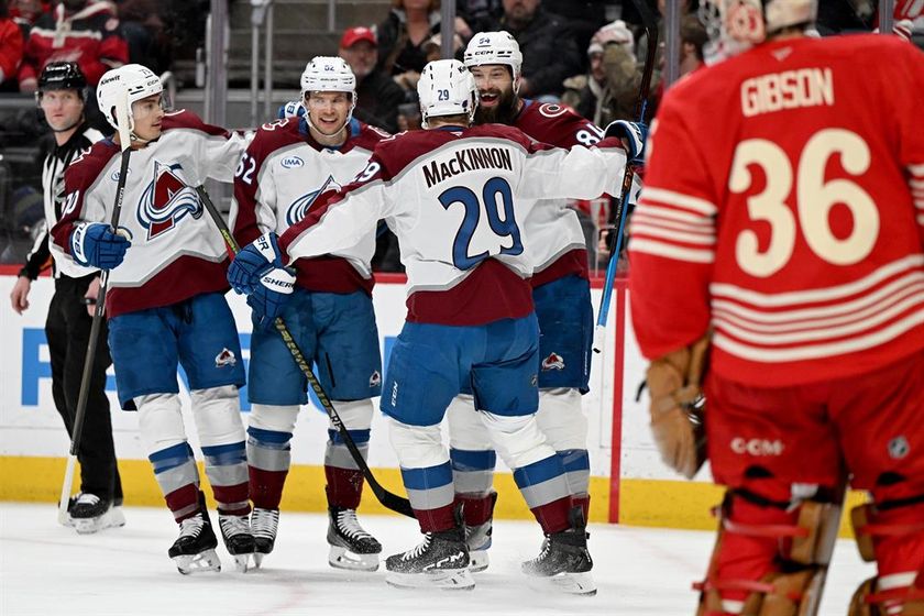 Colorado Avalanche defenseman Brent Burns (84) celebrates with Colorado defenseman Sam Malinski (70), Colorado left wing Artturi Lehkonen (62) and Colorado center Nathan MacKinnon (29) after scoring a goal against Detroit in the first period of an NHL hoc
