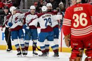 MacKinnon scores twice to become the 1st 40-goal scorer of the season, Avalanche blank Red Wings 5-0