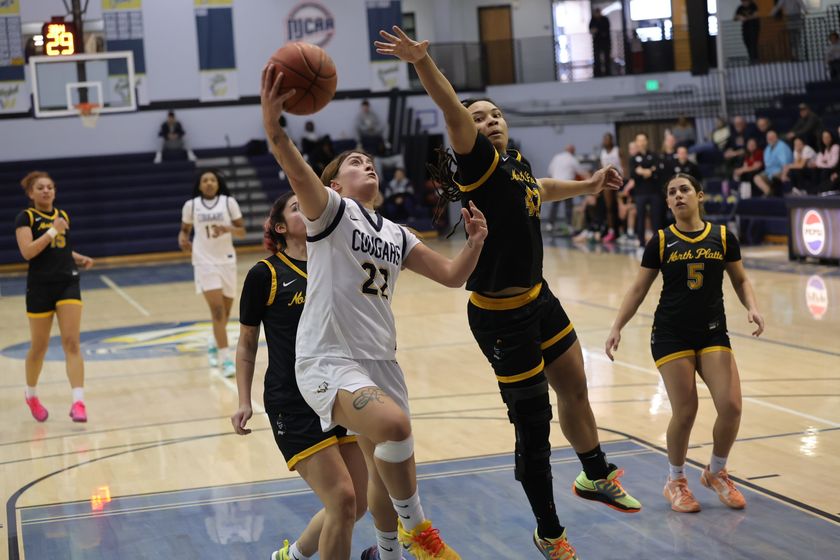 WNCC's Verlyn Aviles goes up for a lay-up while North Platte's Zaily Mazarin defends.