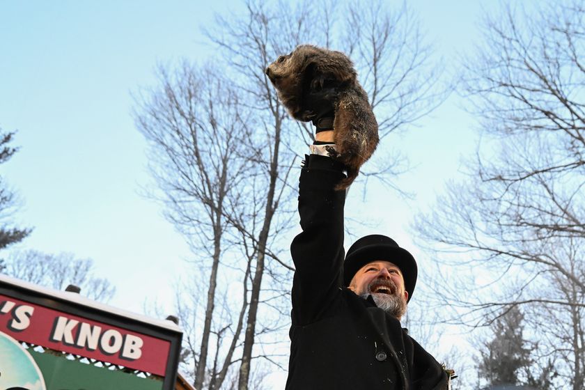Groundhog Club handler A.J. Dereume holds Punxsutawney Phil, the weather prognosticating groundhog, during the 140th celebration of Groundhog Day on Gobbler's Knob in Punxsutawney, Pa., Monday, Feb. 2, 2026.